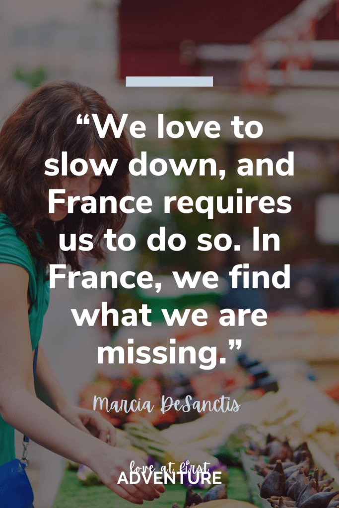 quote on slow travel with woman at market in France