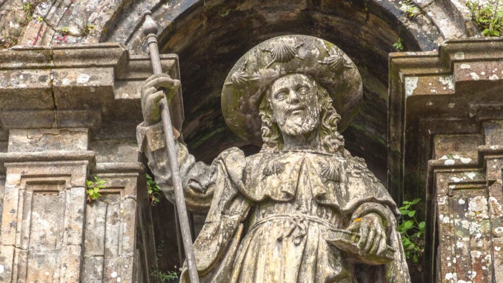 intricate stone statue of a medieval pilgrim